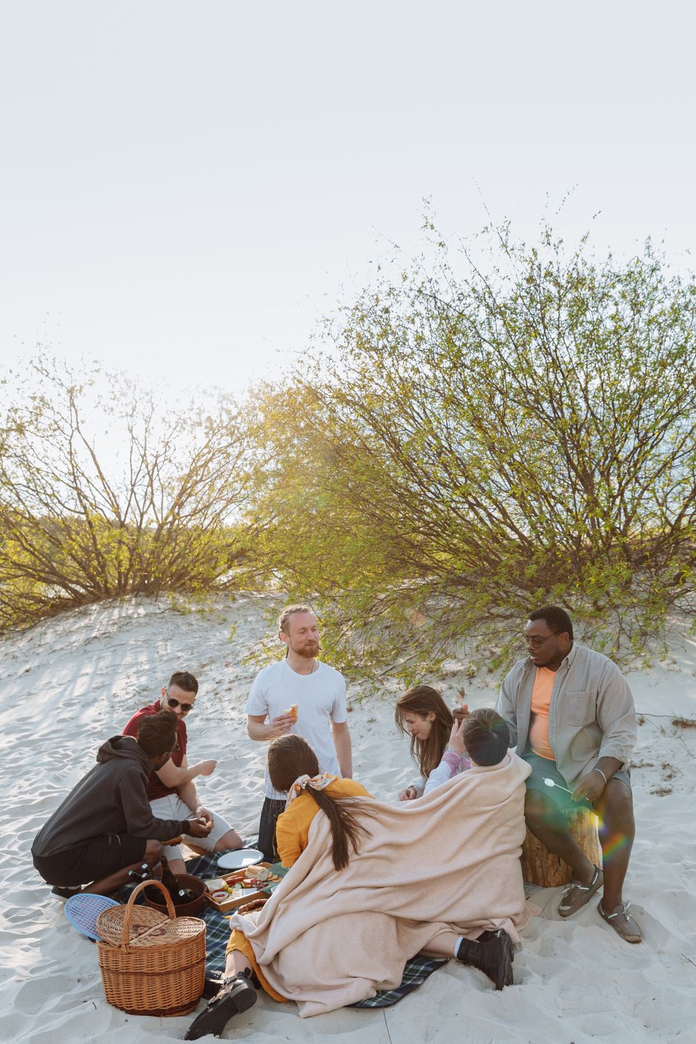 Friends enjoying a beach picnic